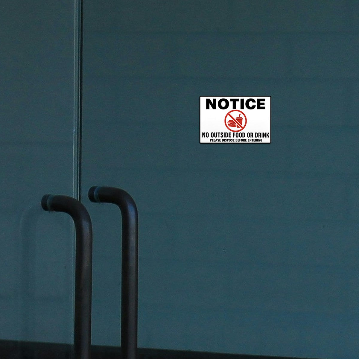 No Outside Food or Drink sticker on a glass store door