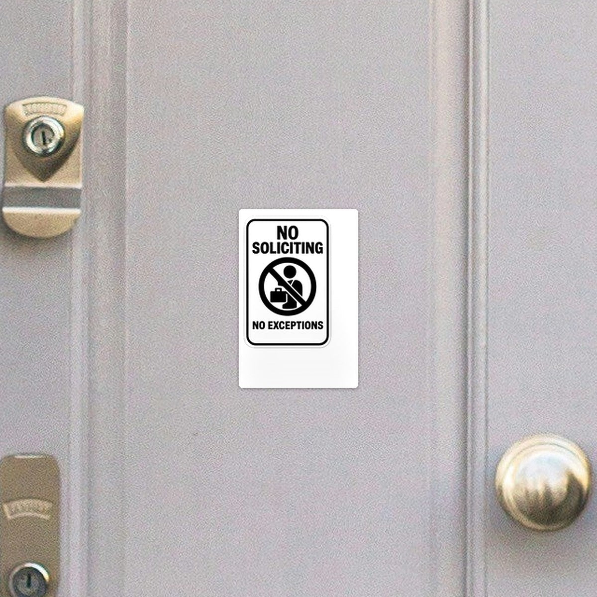No Soliciting sticker on a front door
